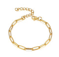 A gold paperclip chain bracelet with a lobster clasp and extender chain, displayed on a clean white background.