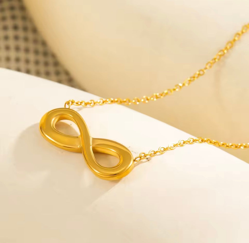 Close-Up of The Evermore Infinity Symbol Pendant Necklace on  a white background