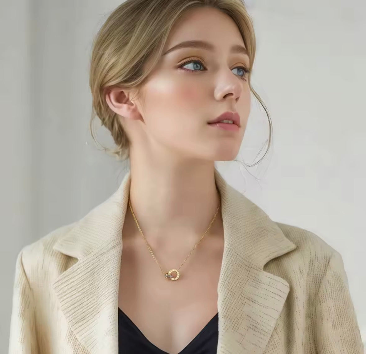 Shop The Eterna Necklace – a stainless steel interlocking circle pendant with sparkling cubic zirconia. Elegant, meaningful and perfect for everyday wear.