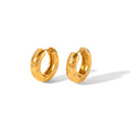 The Aurora Hoops Gold hoop earrings with star designs on a white background