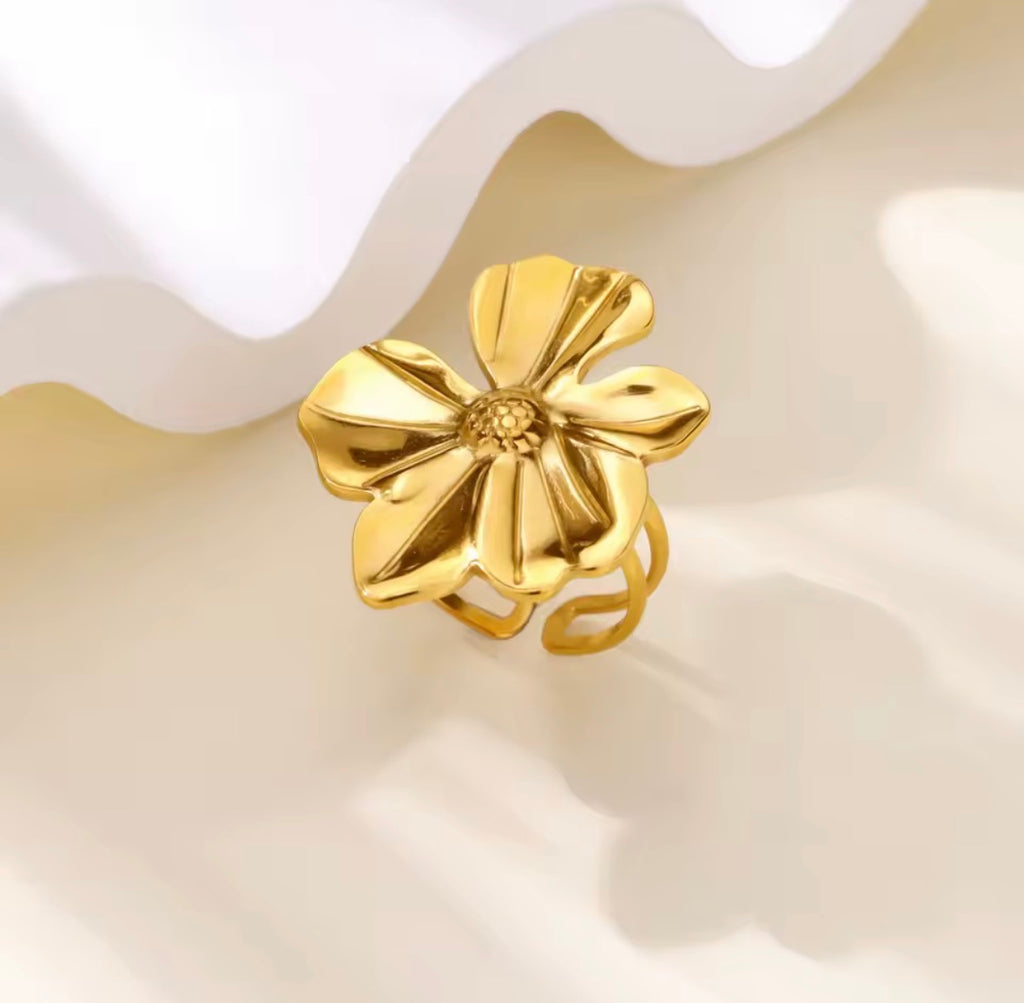The Camellia Ring Gold flower-shaped earring on a white background