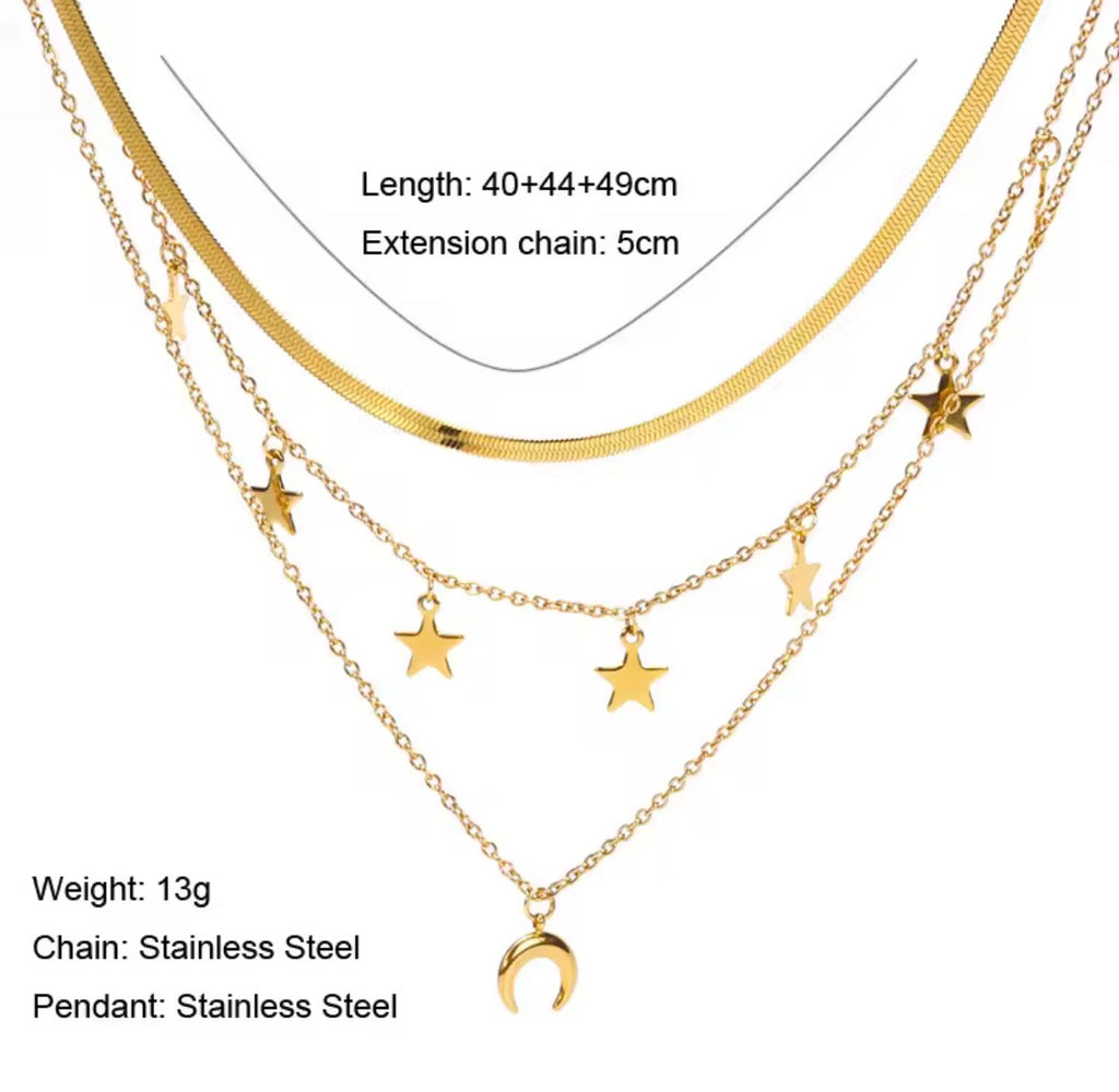 The Celestia Necklace: Gold necklace with star pendants on a white background
