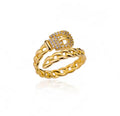 The Cintra Ring with a braided design and a buckle-like top on a white background