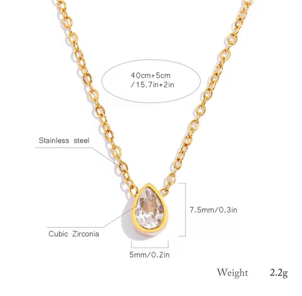Gold necklace with teardrop-shaped pendant and measurements on a white background