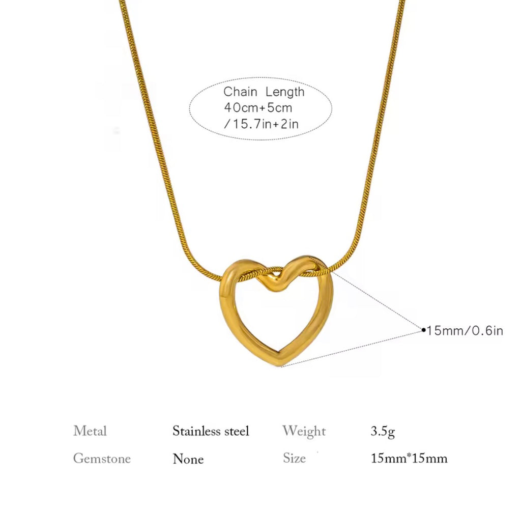 The Esmé Necklace Gold heart-shaped necklace with chain length, metal type, weight, and size information on a white background.