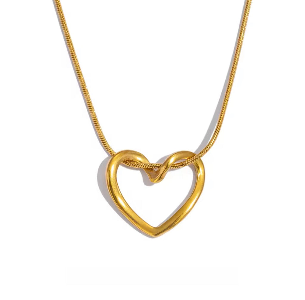 The Esmé Necklace | Waterproof Gold Heart Pendant Necklace for Women Gold heart-shaped necklace on a white background