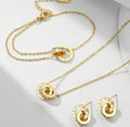 The Eterna Roman Set with necklace and earrings on a white background