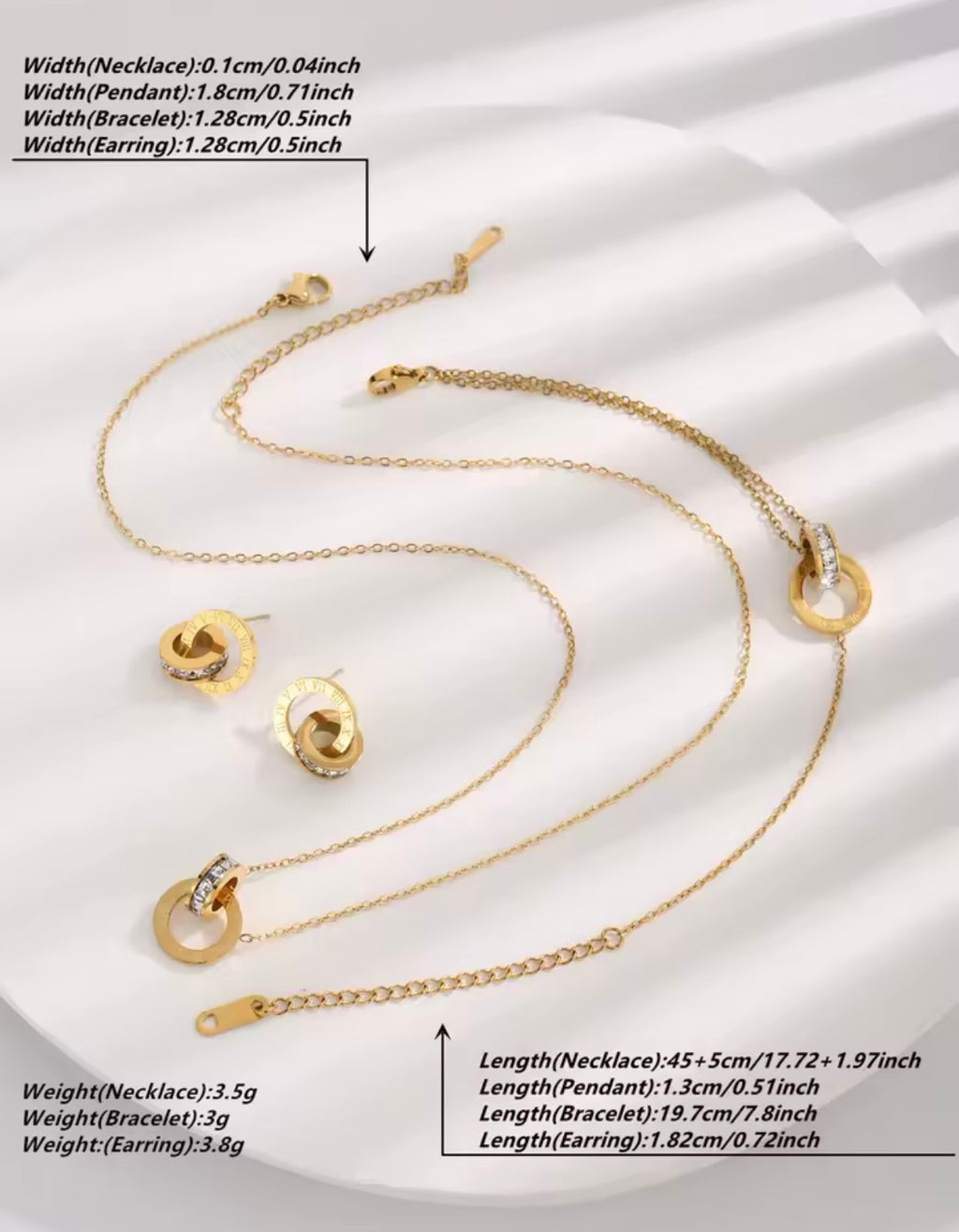 The Eterna Roman set, including necklace, bracelet, and earrings on a white background with measurements.