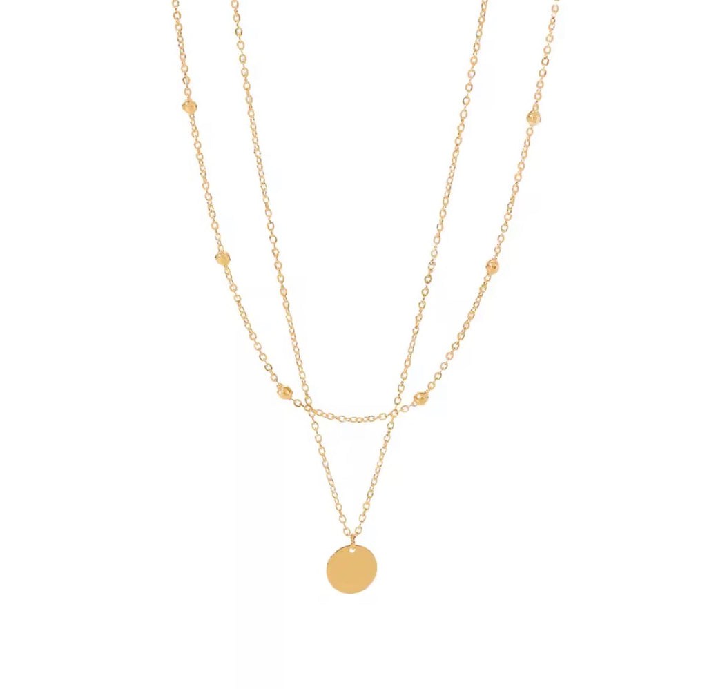 The Evienne Necklace | Waterproof Layered Gold Disc Pendant Necklace for Women Gold necklace with a round pendant on a white background