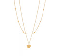 The Evienne Necklace | Waterproof Layered Gold Disc Pendant Necklace for Women Gold necklace with a round pendant on a white background