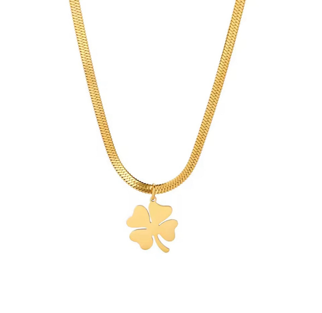 The Felicity Necklace with a clover pendant on a white background