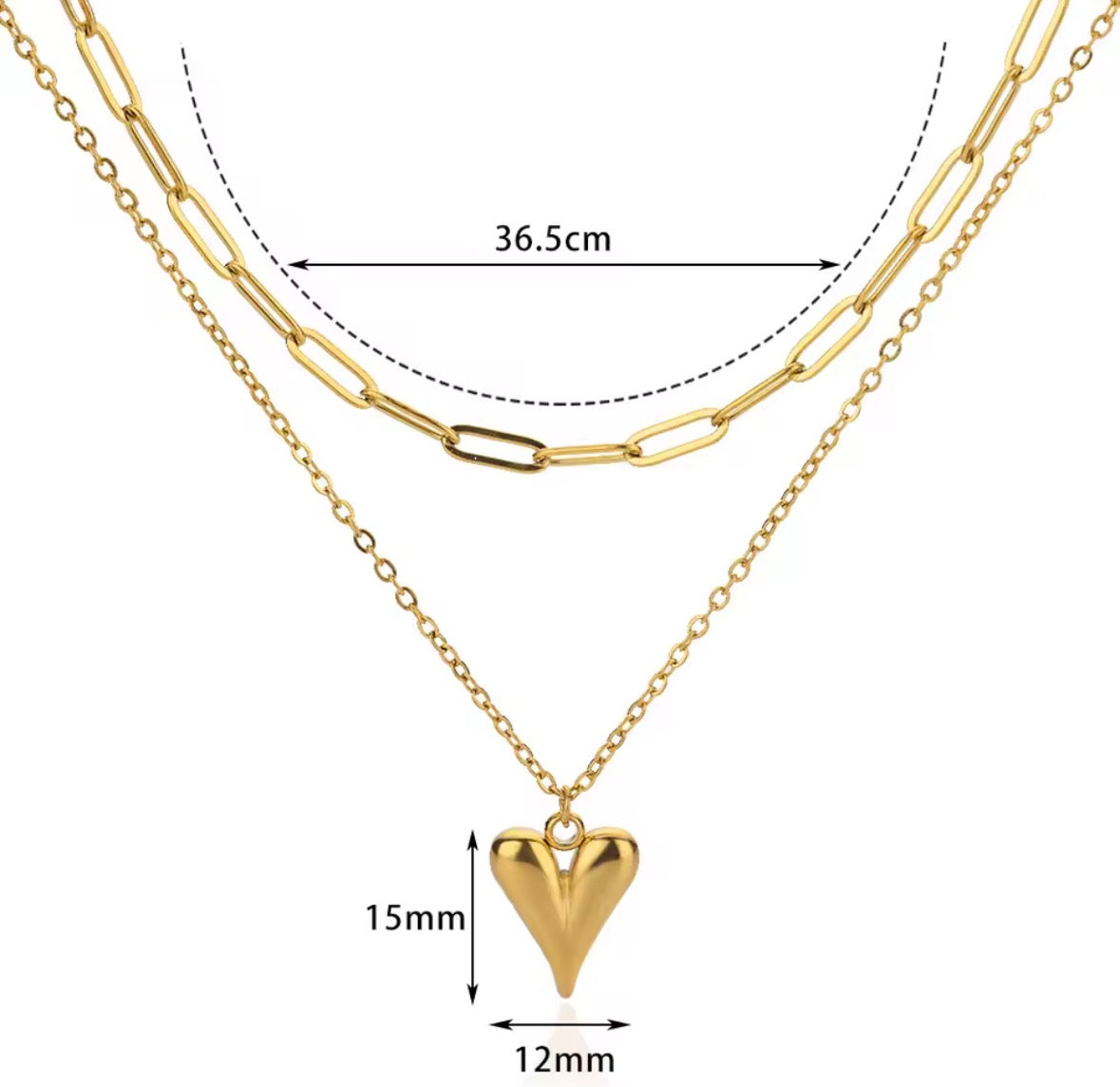 The Fiera Necklace Gold necklace with a heart pendant and measurements on a white background