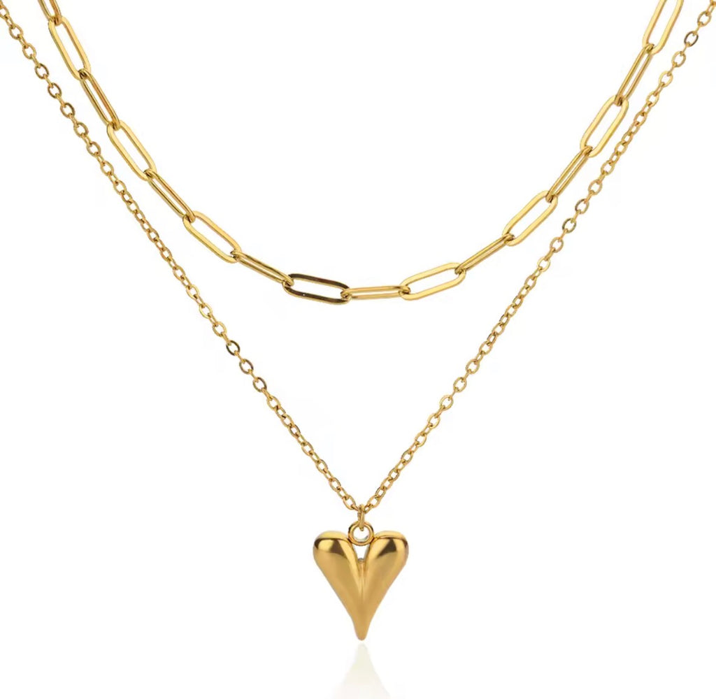 The Fiera Necklace heart pendant necklace on a white background
