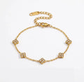 Shop The Florielle Bracelet – a delicate gold-tone stainless steel bracelet with sparkling cubic zirconia flowers. Adjustable, hypoallergenic and perfect for gifting.