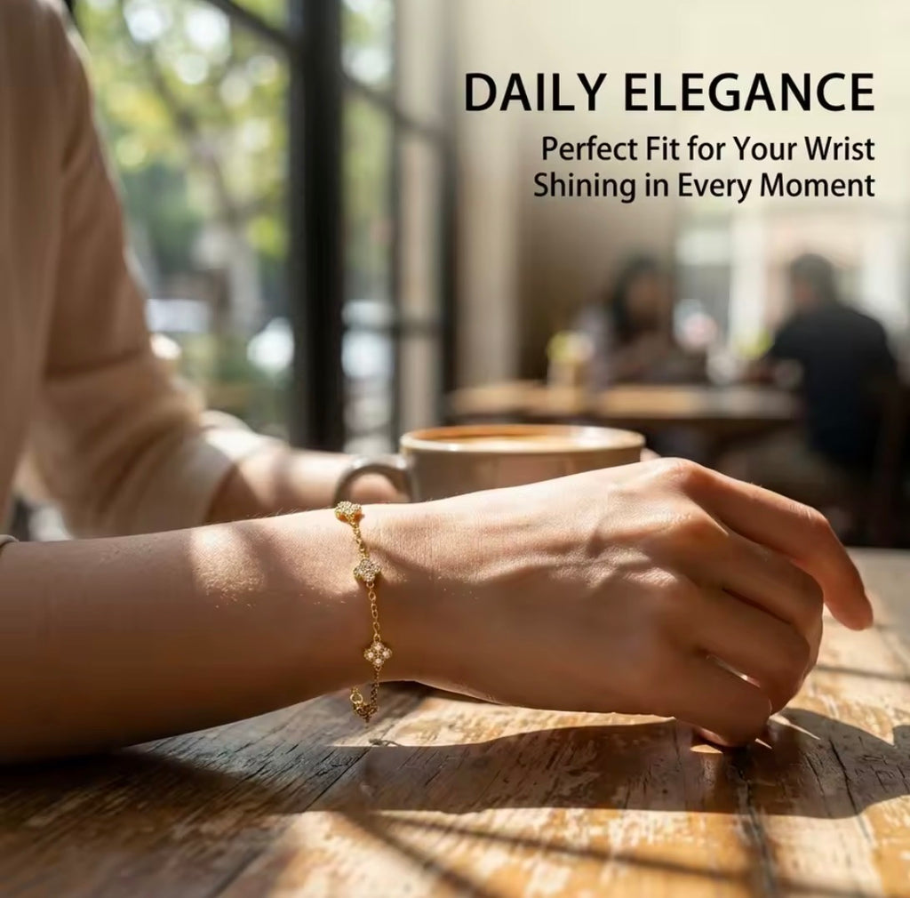 Shop The Florielle Bracelet – a delicate gold-tone stainless steel bracelet with sparkling cubic zirconia flowers. Adjustable, hypoallergenic and perfect for gifting.