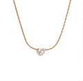 The Grace Necklace Gold necklace with a heart-shaped diamond pendant on a white background