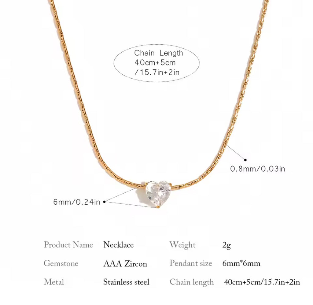 The Grace Necklace with heart-shaped zircon pendant on a white background