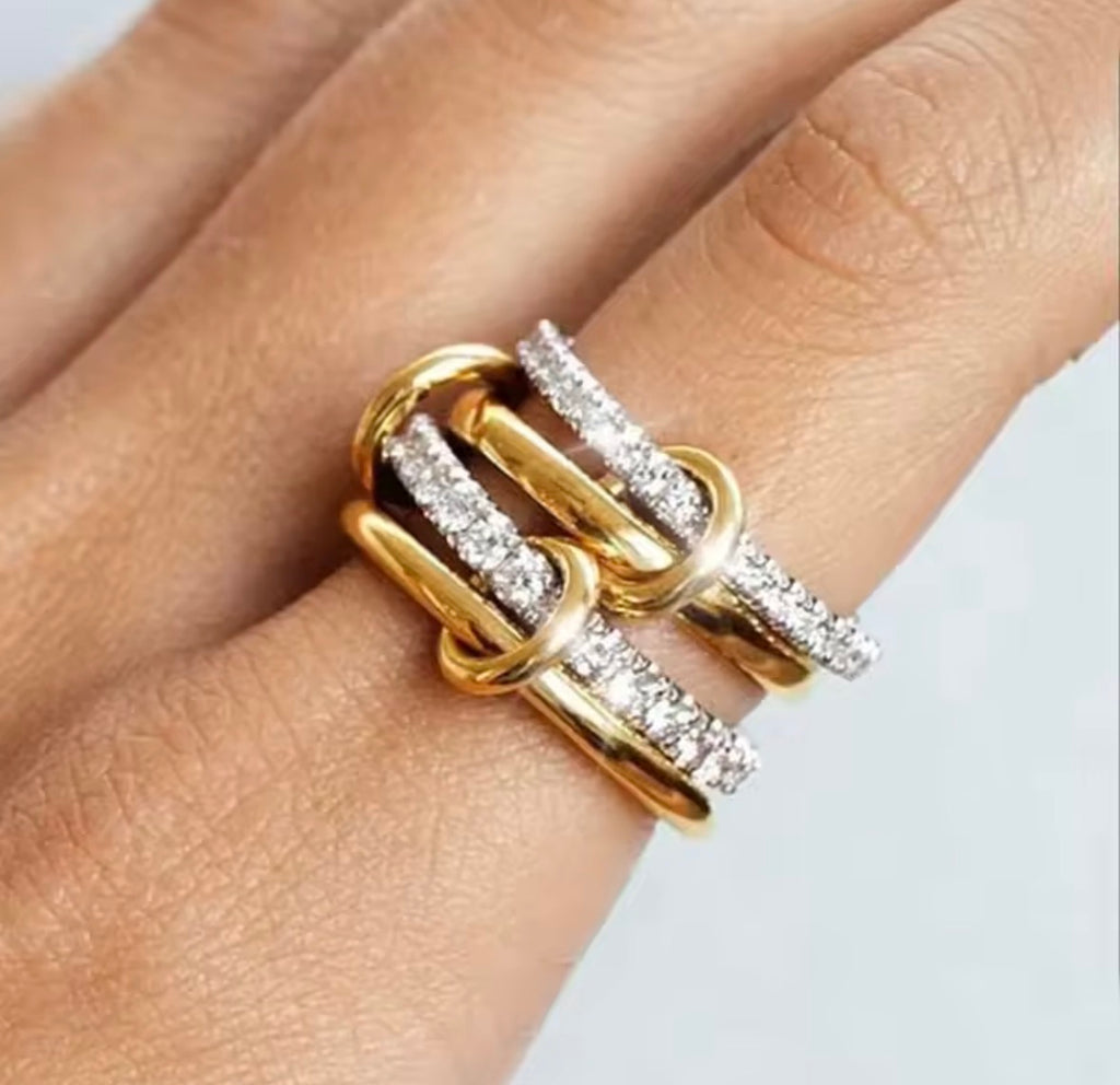 The Harmony Ring Set on a finger against a neutral background