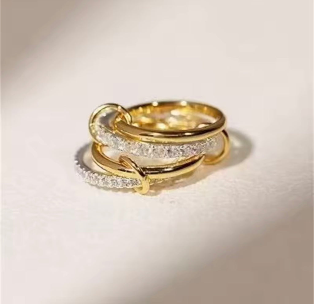 The Harmony Ring Set on a light beige background