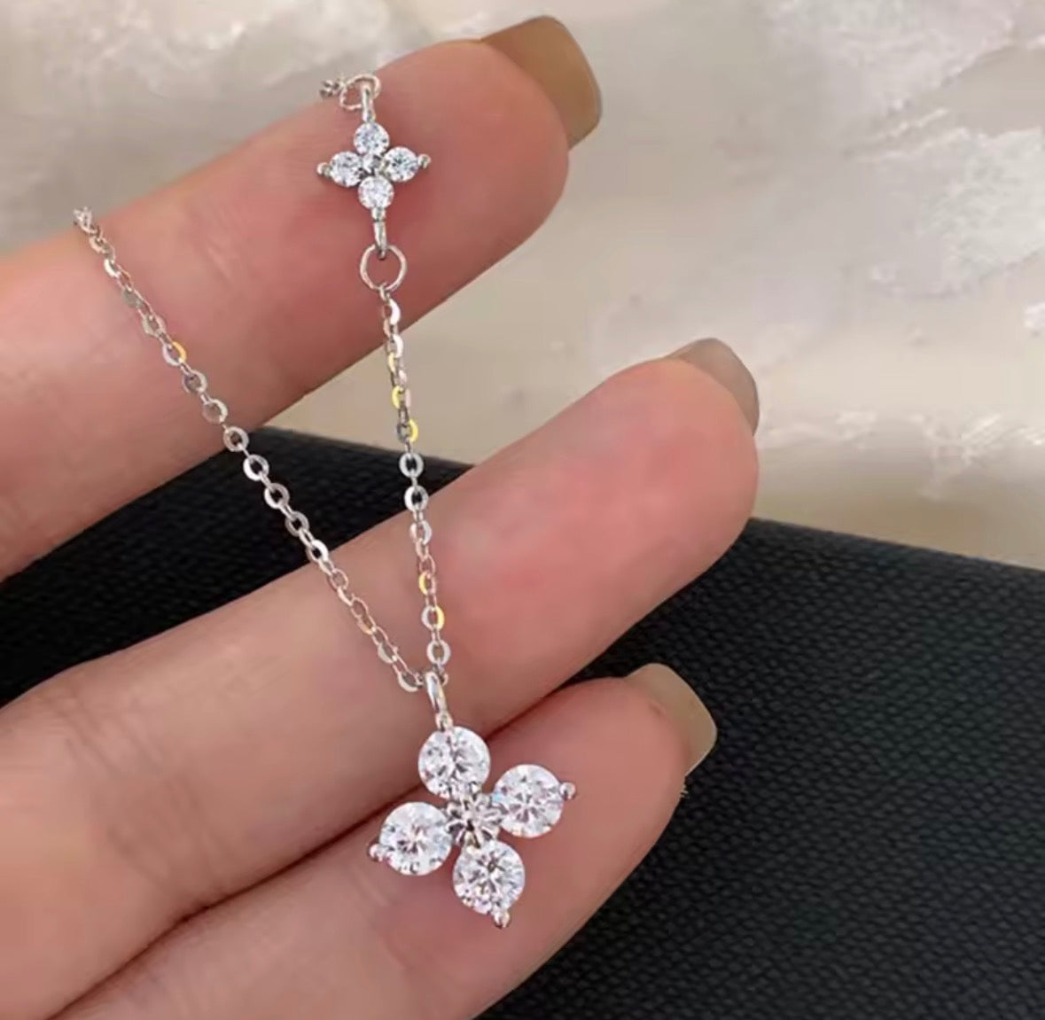 Shop The Ivy Necklace – an elegant floral pendant necklace with sparkling cubic zirconia details. Delicate, feminine and perfect for everyday wear or gifting.