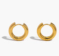  The Jolie Hoops Pair of gold hoop earrings on a white background
