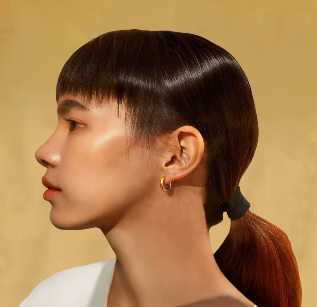  The Jolie Hoops Side profile of a person with a high ponytail against a beige background