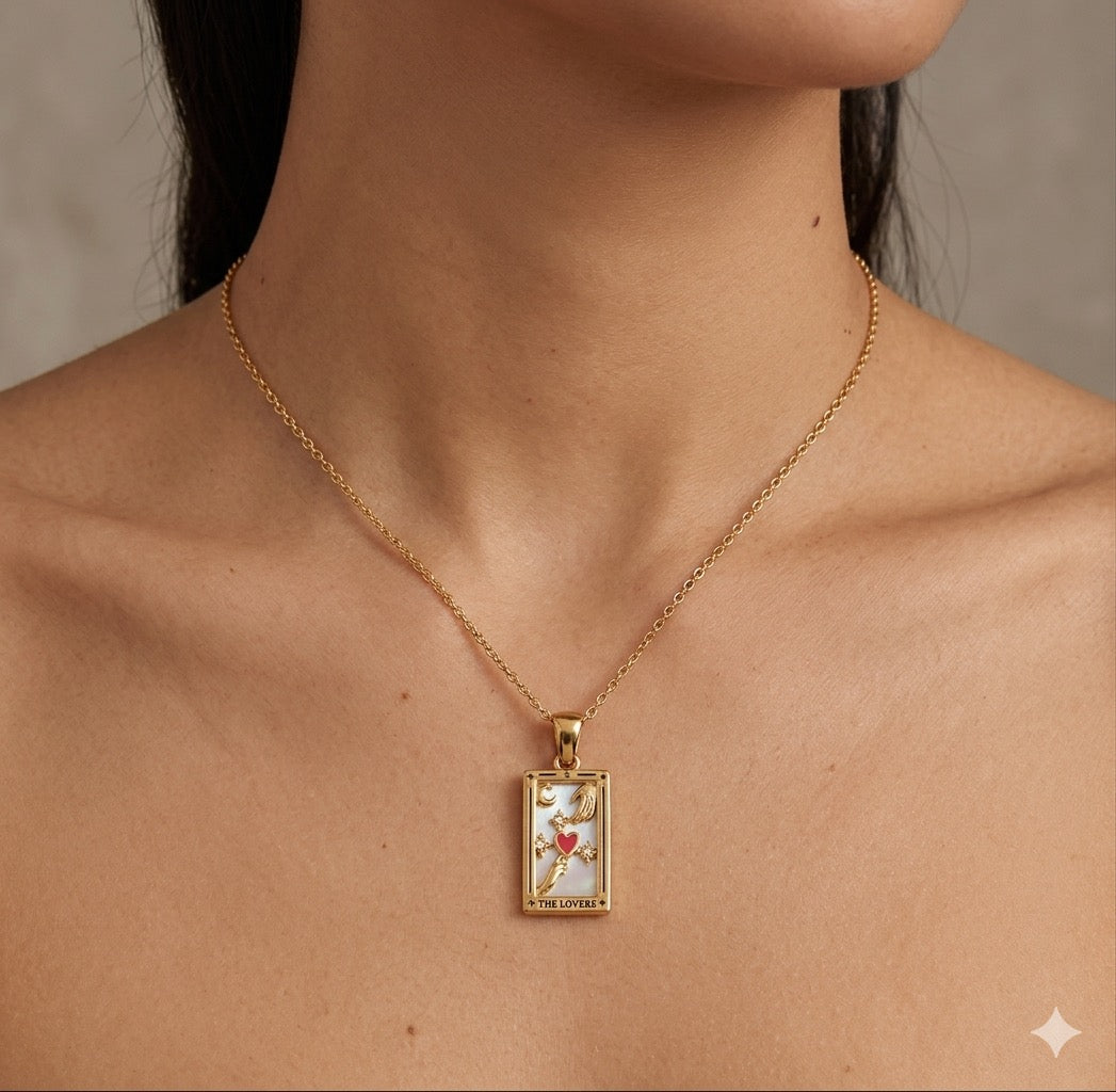 The Lovers Necklace Gold necklace with a pendant on a person's neck against a neutral background
