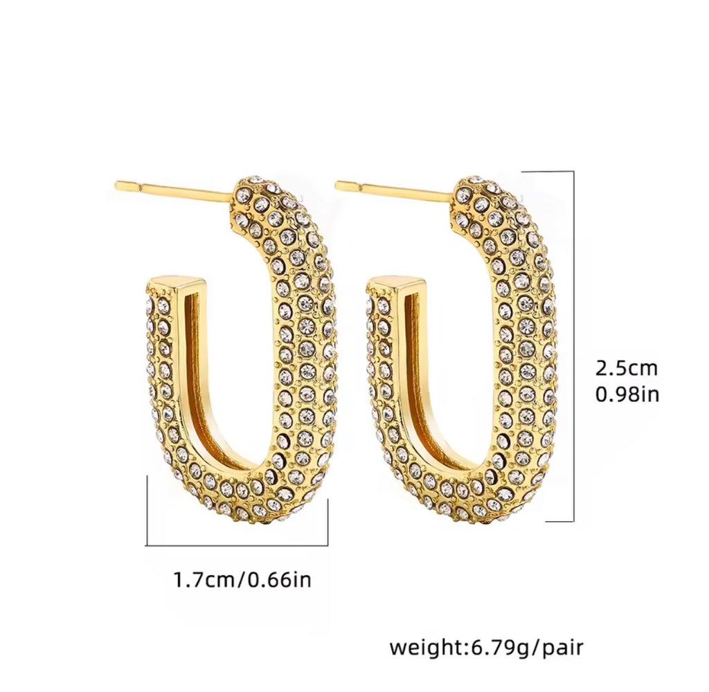 The Lyra Huggies  Gold hoop earrings with clear stones and measurements on a white background