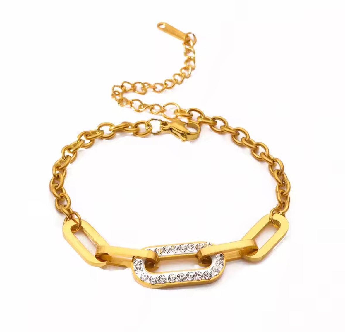 Shop The Maëva Bracelet – a bold 316L stainless steel link bracelet with 18K PVD gold plating and sparkling crystal detail. Waterproof and tarnish-resistant.