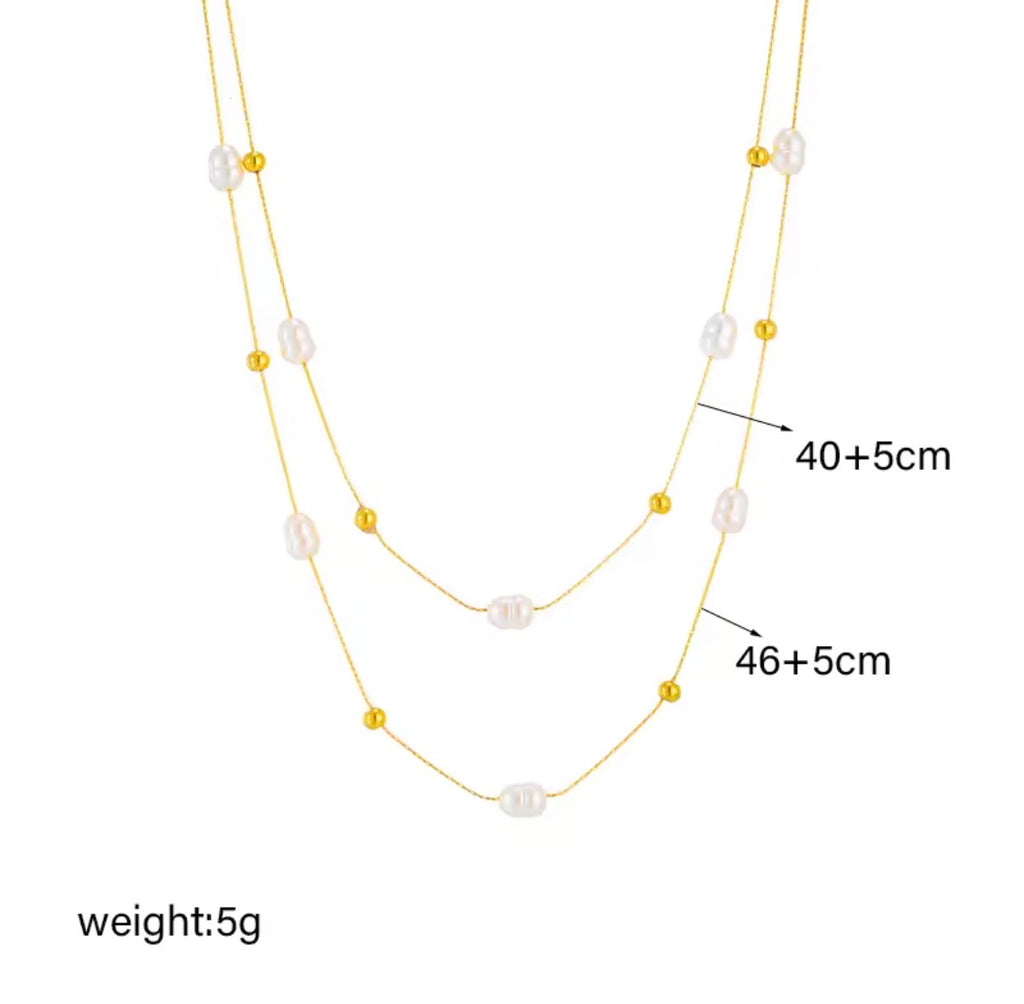 The Marceline Necklace   Gold and pearl necklace with measurements on a white background