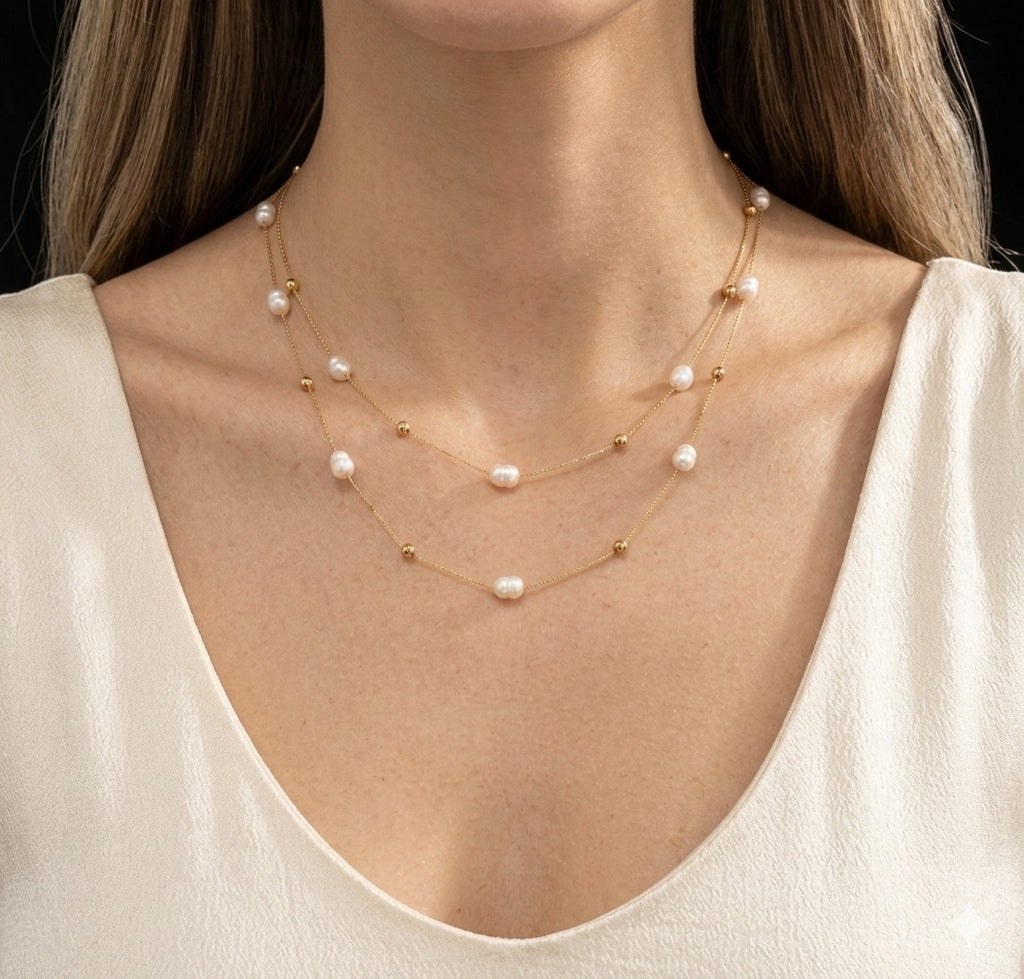 The Marceline Necklace Pearl necklace worn by a person against a neutral background