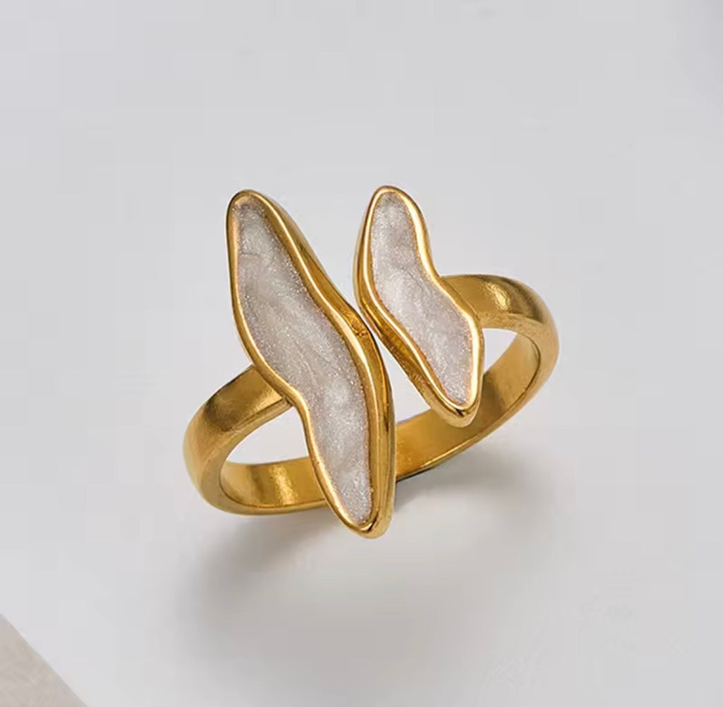 The Ondine Ring Gold and white ring on a light gray background