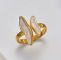 The Ondine Ring Gold and white ring on a light gray background
