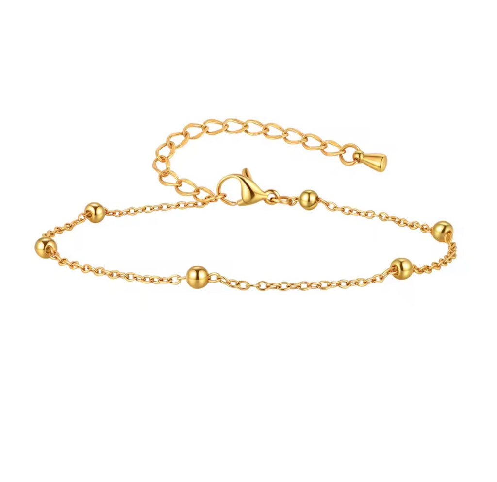 The Oriana Anklet | Waterproof Gold Beaded Chain Anklet for Women Gold bracelet with a clasp on a white background