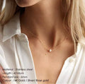 The Perla Necklace with a pearl pendant worn by a person, displayed against a neutral background.