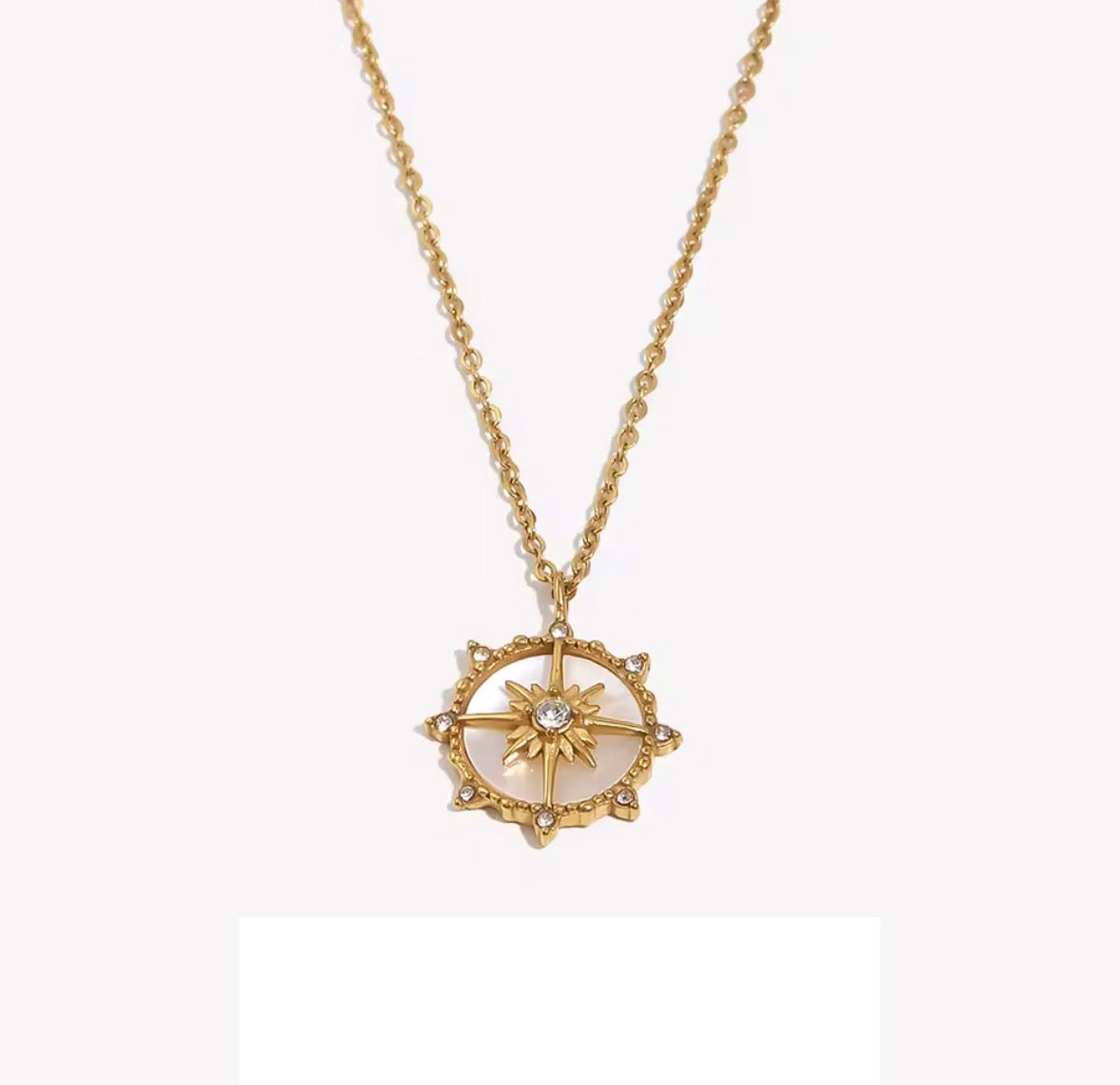 Shop The Polaris Necklace – an 18K PVD gold-plated stainless steel compass pendant with sparkling cubic zirconia. Waterproof, tarnish-resistant and hypoallergenic.