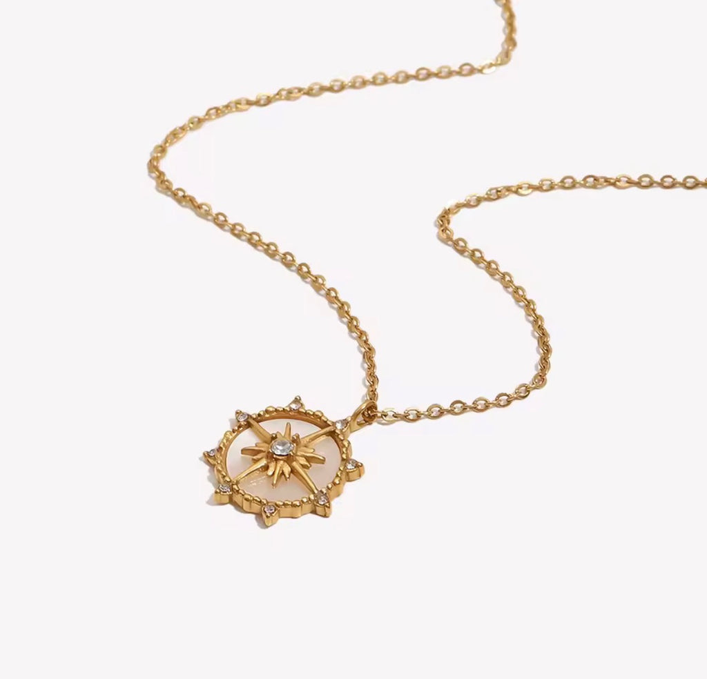 Shop The Polaris Necklace – an 18K PVD gold-plated stainless steel compass pendant with sparkling cubic zirconia. Waterproof, tarnish-resistant and hypoallergenic.