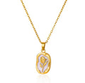 The Rosalie Necklace with a pendant featuring a floral design on a white background