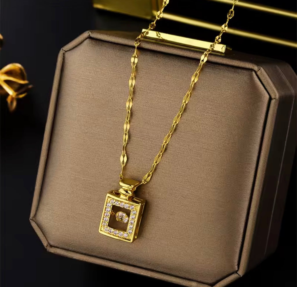 The Sillage Necklace Waterproof Perfume Bottle Pendant Necklace on  beige background