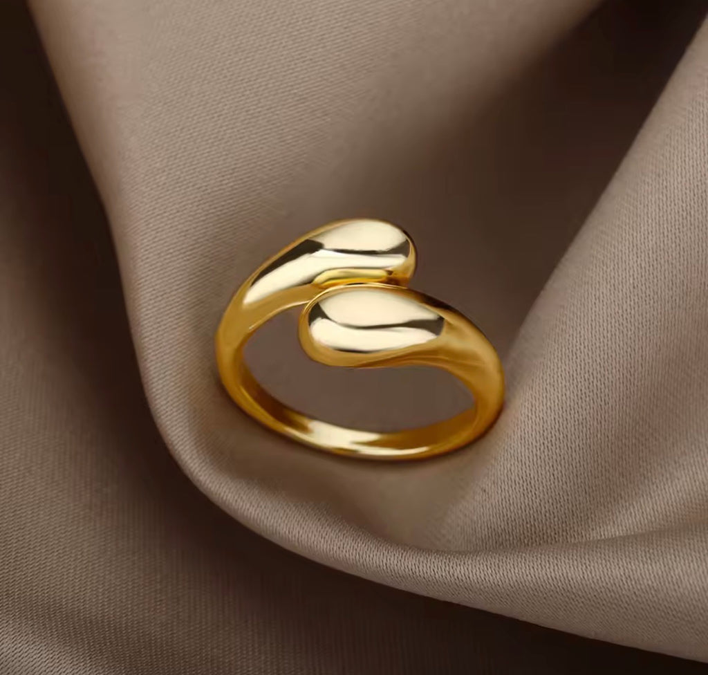 The Unity Ring on a beige fabric background  
