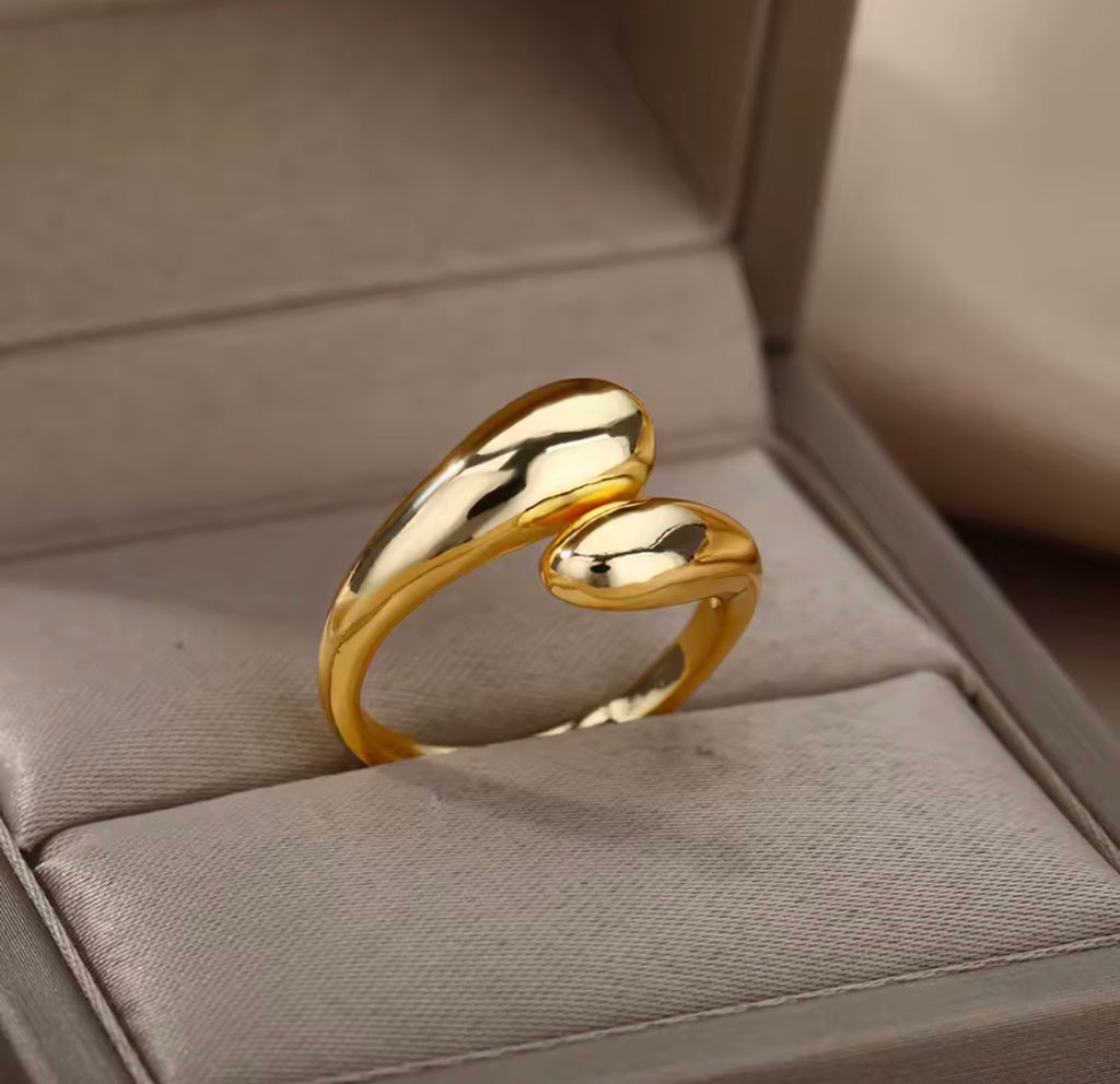 The Unity Ring on a soft gray surface