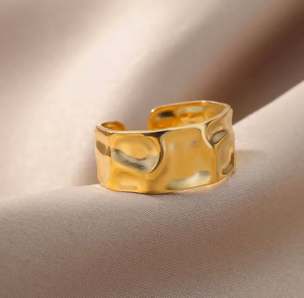 The Vesper Ring on a beige background