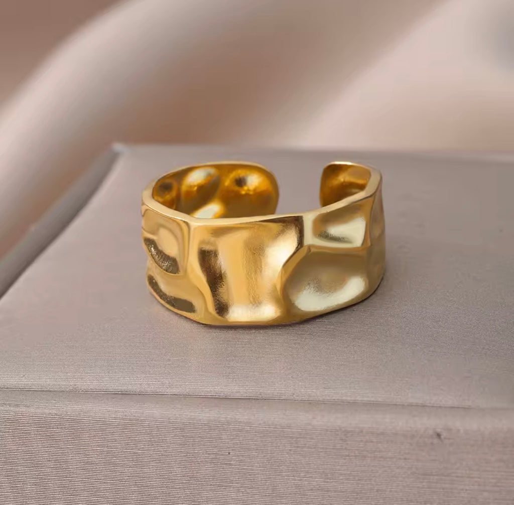 The Vesper Ring on a textured surface