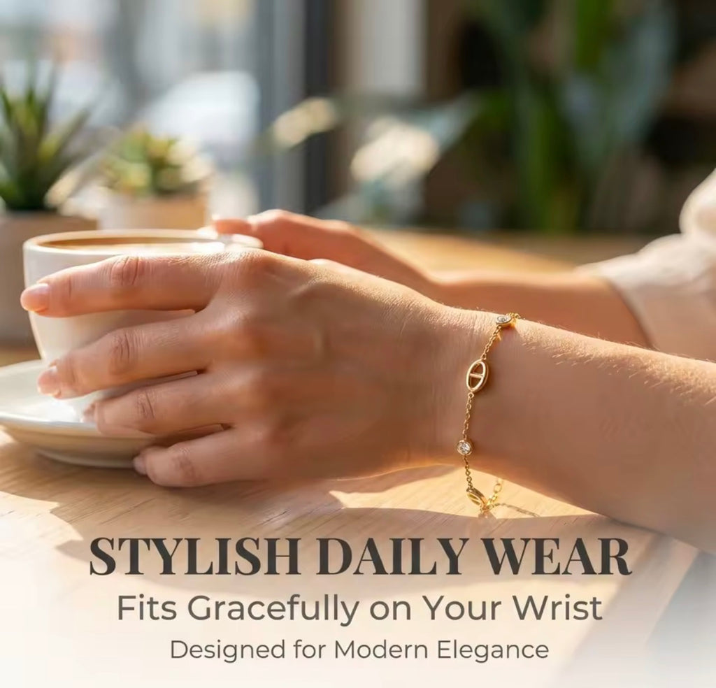 Shop The Celestine Bracelet – an elegant gold-tone stainless steel bracelet with geometric oval motifs and sparkling white zircon accents. Adjustable and hypoallergenic.